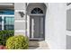 Gray front door with arched window and sidelights, welcoming entryway at 1161 Roxboro Rd, Longwood, FL 32750