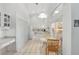 Well-lit kitchen boasting white cabinetry, tile flooring, and a sunlit breakfast nook at 1161 Roxboro Rd, Longwood, FL 32750