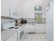 Clean, all-white kitchen with modern appliances and ample natural light at 1161 Roxboro Rd, Longwood, FL 32750