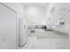 Bright kitchen with white appliances, ample storage, and clean, modern design at 1161 Roxboro Rd, Longwood, FL 32750