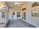 Enclosed lanai features an outdoor ceiling fan, bright natural lighting, and multiple access points at 1161 Roxboro Rd, Longwood, FL 32750