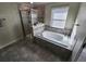 Bathroom with soaking tub, shower, and tile flooring at 11743 Stein St, Orlando, FL 32832