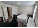 Well-lit bedroom with double doors and a comfortable bed at 11743 Stein St, Orlando, FL 32832