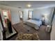 Large bedroom with king bed, ensuite bathroom access, and sitting area at 11743 Stein St, Orlando, FL 32832