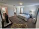 Spacious bedroom with carpeted floor and large bed at 11743 Stein St, Orlando, FL 32832