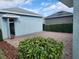 Attached garage with paver driveway and lush landscaping at 11743 Stein St, Orlando, FL 32832