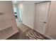 Upstairs hallway with carpet and neutral walls at 11743 Stein St, Orlando, FL 32832