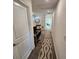 Upstairs hallway with carpeted flooring and access to bedrooms at 11743 Stein St, Orlando, FL 32832