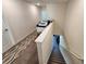 Upstairs hallway with stairs leading downstairs at 11743 Stein St, Orlando, FL 32832