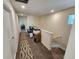 Upstairs hallway with computer station and view to the stairs at 11743 Stein St, Orlando, FL 32832