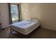 Sunlit bedroom with large window and neutral carpet at 1341 Arbor Vista Loop # 113, Lake Mary, FL 32746