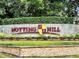 Notting Hill community entrance sign with landscaping at 1341 Arbor Vista Loop # 113, Lake Mary, FL 32746