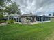 Property showcasing a sunroom and screened patio area at 1641 Lake Marion Dr, Apopka, FL 32712