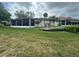 House exterior with a screened patio and fountain at 1641 Lake Marion Dr, Apopka, FL 32712