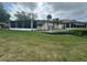 House exterior with a screened patio and fountain at 1641 Lake Marion Dr, Apopka, FL 32712