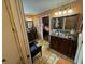 Elegant bathroom with double sinks, large mirror and a walk-in shower at 1641 Lake Marion Dr, Apopka, FL 32712