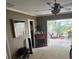 Bright bedroom with fireplace, access to sunroom, and walk-in closet at 1641 Lake Marion Dr, Apopka, FL 32712