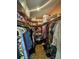 Large walk-in closet with shelves and hanging rods at 1641 Lake Marion Dr, Apopka, FL 32712