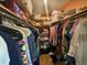 Walk-in closet with ample hanging space at 1641 Lake Marion Dr, Apopka, FL 32712