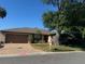 Single-story home with a two-car garage and landscaped yard at 1641 Lake Marion Dr, Apopka, FL 32712