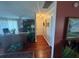 Long hallway with hardwood floors and neutral walls at 1641 Lake Marion Dr, Apopka, FL 32712