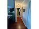 Clean hallway with hardwood floors and neutral walls at 1641 Lake Marion Dr, Apopka, FL 32712