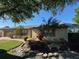 Tan house exterior with lush landscaping and a sunroom at 1641 Lake Marion Dr, Apopka, FL 32712