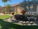 Tan house exterior with manicured landscaping and stone accents at 1641 Lake Marion Dr, Apopka, FL 32712