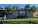 Front view of a single-story house with palm trees at 1641 Lake Marion Dr, Apopka, FL 32712