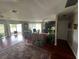Bright living room with hardwood floors and access to patio at 1641 Lake Marion Dr, Apopka, FL 32712