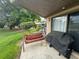 Relaxing patio with seating area and grill at 1641 Lake Marion Dr, Apopka, FL 32712