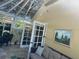 Sunroom features a glass ceiling and comfortable seating at 1641 Lake Marion Dr, Apopka, FL 32712