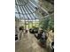 Relaxing sunroom with multiple seating areas and garden views at 1641 Lake Marion Dr, Apopka, FL 32712