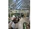 Sunroom with seating area, skylights, and garden views at 1641 Lake Marion Dr, Apopka, FL 32712