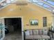 Sunroom with a view into adjacent living room at 1641 Lake Marion Dr, Apopka, FL 32712