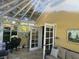 Spacious sunroom with glass roof and interior access at 1641 Lake Marion Dr, Apopka, FL 32712