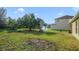 Yard with fire pit and mature trees at 218 Black Springs Ln, Winter Garden, FL 34787
