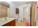 Clean bathroom with a single sink vanity and shower/tub combo at 218 Black Springs Ln, Winter Garden, FL 34787
