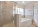Bathroom featuring a large shower and a separate tub at 218 Black Springs Ln, Winter Garden, FL 34787