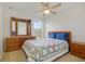 Bedroom with a full bed, ceiling fan, and dresser at 218 Black Springs Ln, Winter Garden, FL 34787