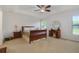Primary bedroom with a king-size bed, and ceiling fan at 218 Black Springs Ln, Winter Garden, FL 34787