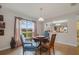 Charming breakfast nook with a round table and three chairs at 218 Black Springs Ln, Winter Garden, FL 34787