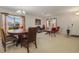 Elegant dining room with a large wooden table and comfortable seating at 218 Black Springs Ln, Winter Garden, FL 34787