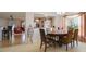 Bright dining area with a round table and access to the kitchen at 218 Black Springs Ln, Winter Garden, FL 34787