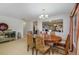Open concept dining room with views into the kitchen at 218 Black Springs Ln, Winter Garden, FL 34787