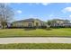 Single-story house with a landscaped lawn and attached garage at 218 Black Springs Ln, Winter Garden, FL 34787