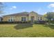 One-story house with a green door and well-maintained lawn at 218 Black Springs Ln, Winter Garden, FL 34787