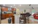 Modern kitchen with wooden cabinets, granite countertops and stainless steel appliances at 218 Black Springs Ln, Winter Garden, FL 34787