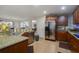 Modern kitchen with stainless steel appliances and granite countertops at 218 Black Springs Ln, Winter Garden, FL 34787