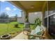 Covered patio with seating and lush greenery at 218 Black Springs Ln, Winter Garden, FL 34787